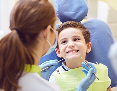 A child receiving treatment from their dentist