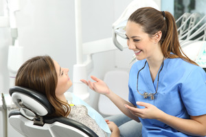 Patient talking to a dental hygienist