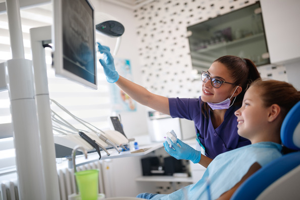 pediatric dentist showing child X-ray 